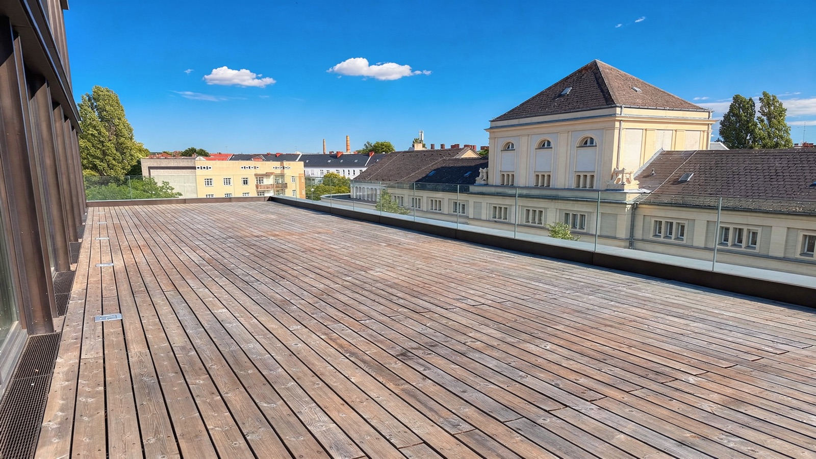 The Sundowner Terrace at golden hour, cocktail reception overlooking Berlin